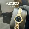 ساعت سیکو زنانه نقرهای،طلایی با صفحه مشکی- SEIKO